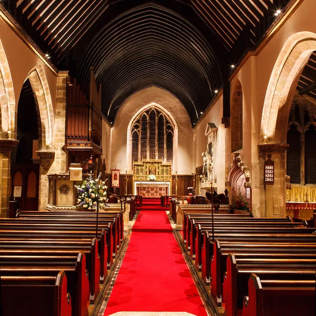 Bright service lighting inGoldsborough church with surface mounted LED fittings lighting the arches and altar window