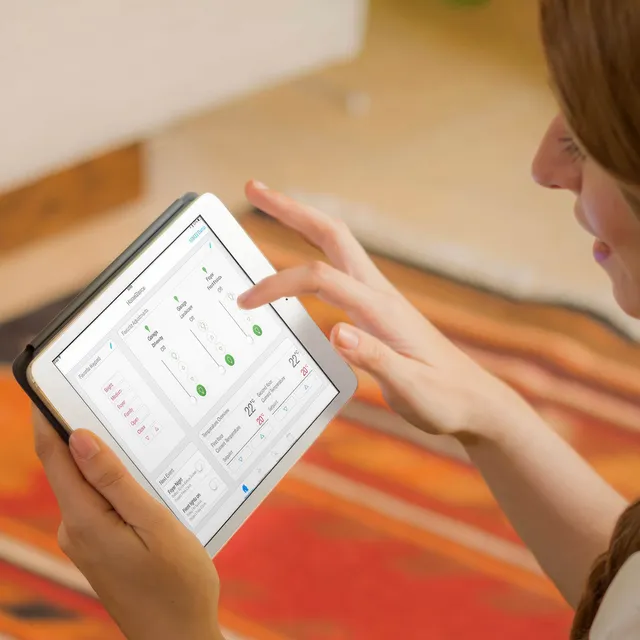 Woman using the Lutron app on an iPad