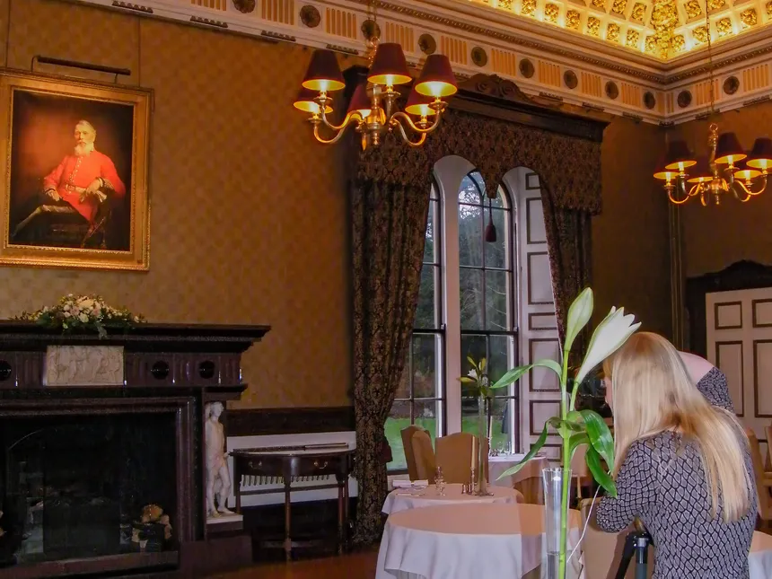 Charlotte Gale photographing a family portrait in Samuel's Restaurant at Swinton Park Hotel