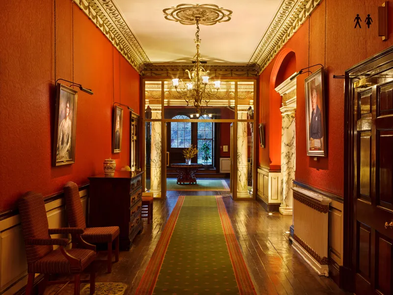 Bespoke ArtView picture lights and uplit marble columns in a luxury country house hotel