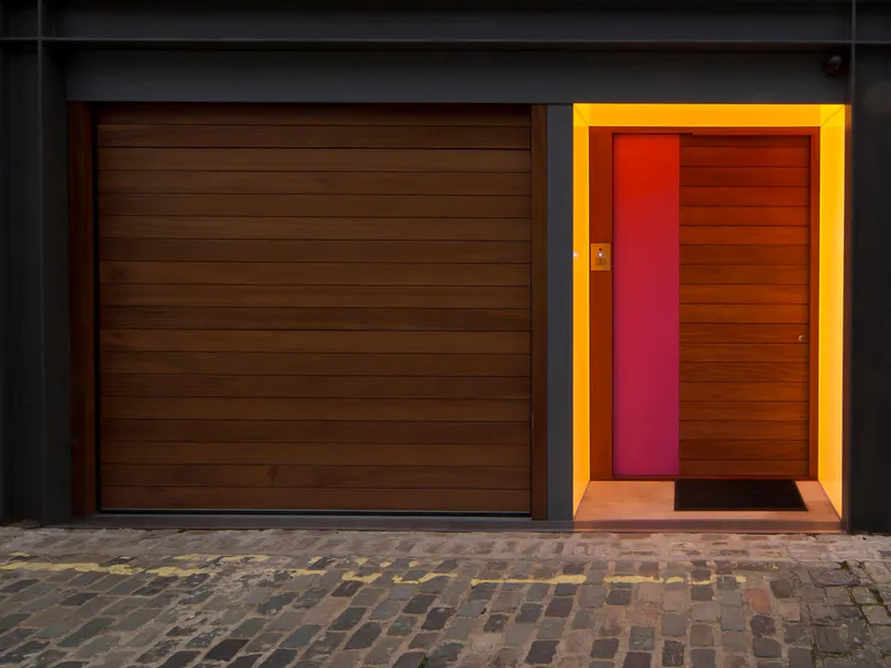 A London mews front door with colour changing LED Lightsheet - lemon