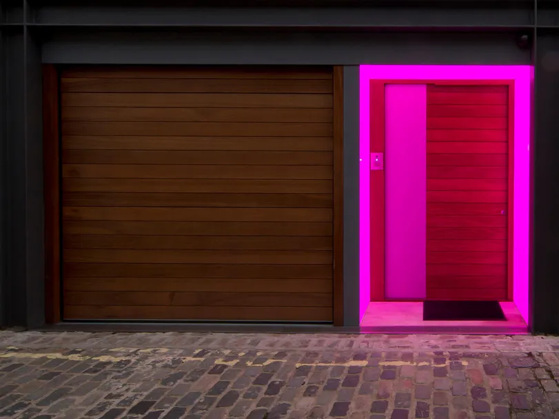 A London mews front door with colour changing LED Lightsheet - pink