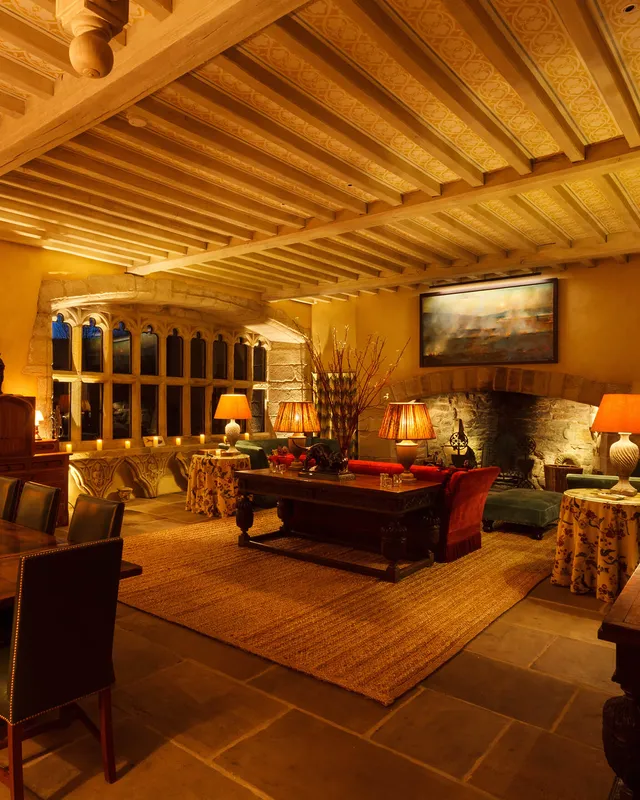 A high-ceiling medieval hall converted into a comfortable living and dining room