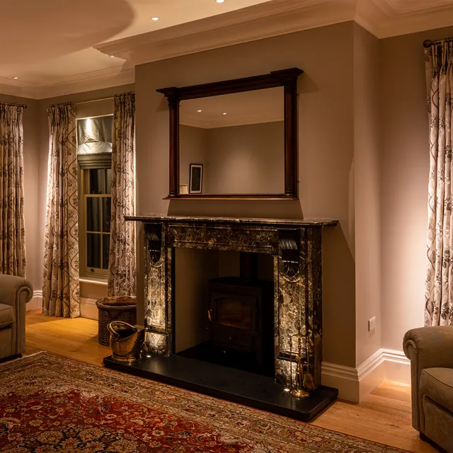 Fire hearth lit with recessed uplights