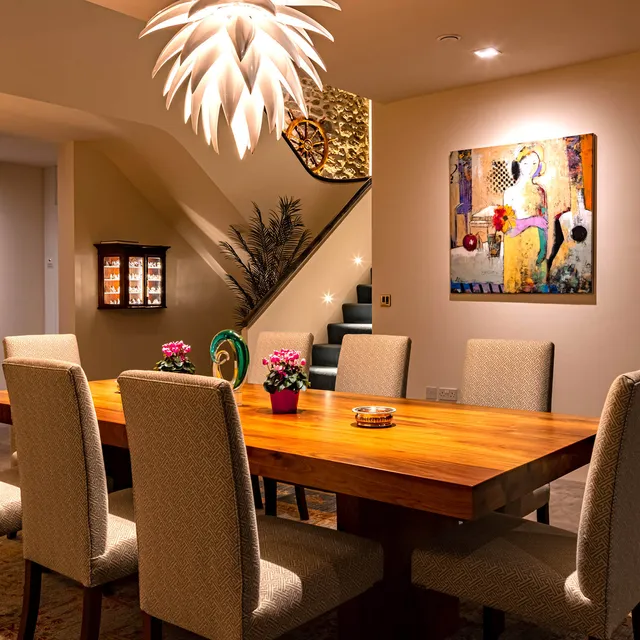 A dining room with a striking chandelier in a new-build modern house