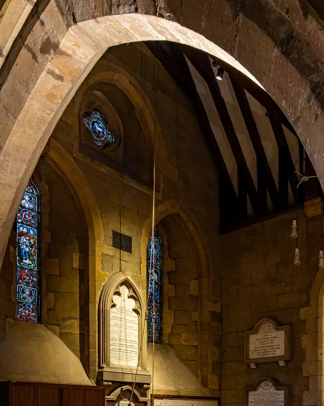 Surface mounted LED fittings lighting the arches and memorials of the church