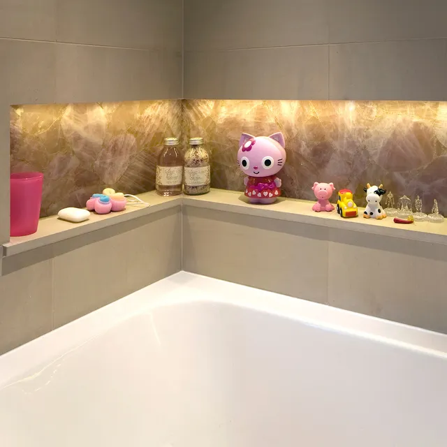 A brightly lit niche in a fun child's bathroom