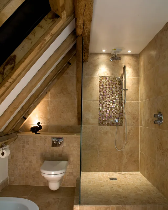 Uplighting and downlights in the shower of a low-ceilinged bathroom