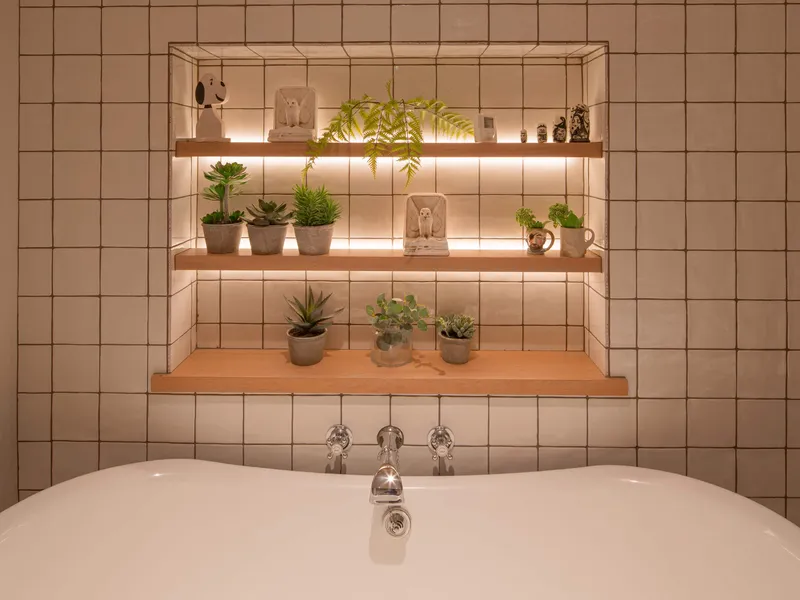 LED linear backlit shelves in a stylish bathroom