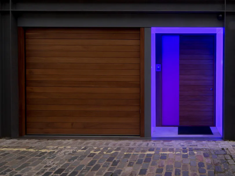 A London mews front door with colour changing LED Lightsheet - indigo