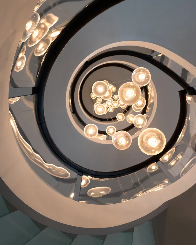 a 36 drop bocci chandelier drops 4 storeys through a large new-build family home