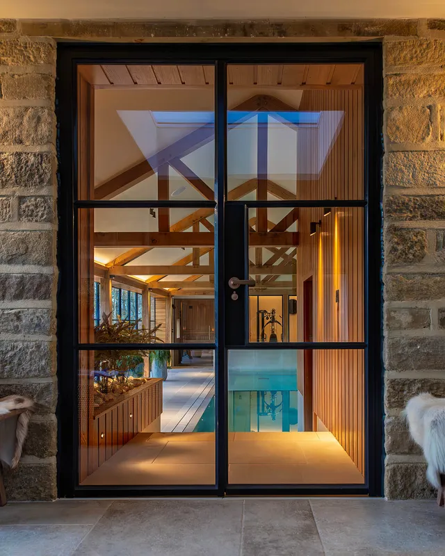 View on an indoor pool room through a glass door