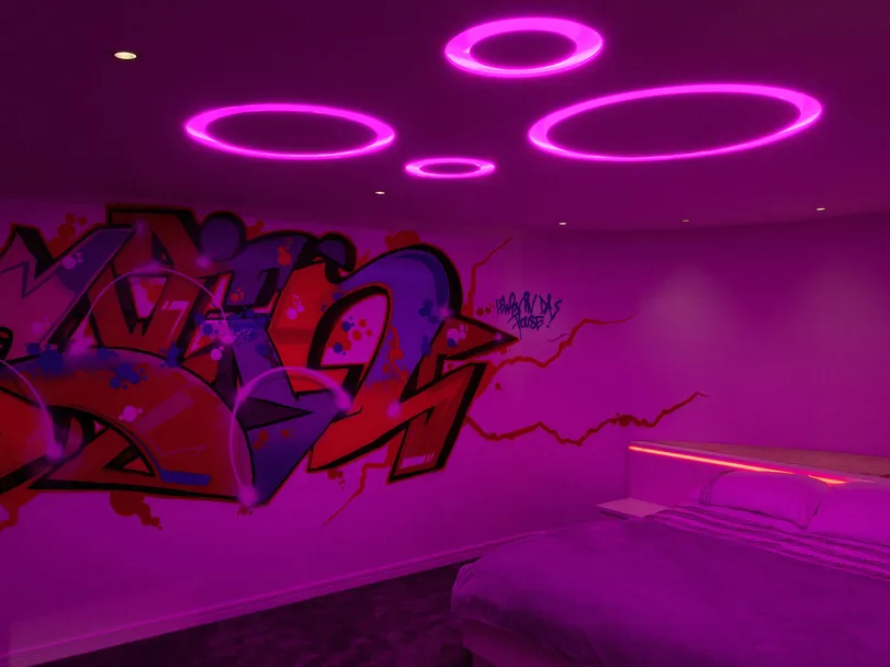 Colour changing LED fittings in a teenager's bedroom with grafiti on the wall