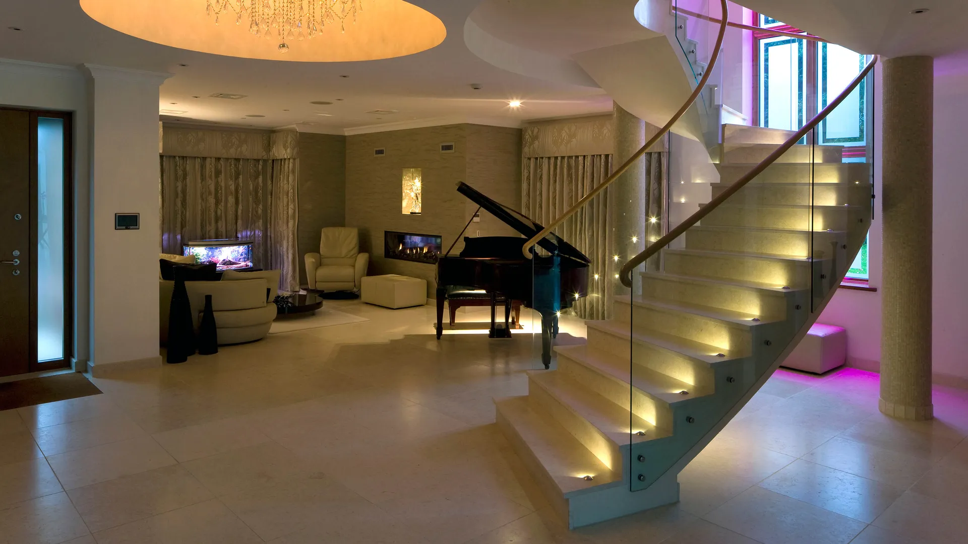 A strikingly lit stone and marble staircase with a grand piano in the background