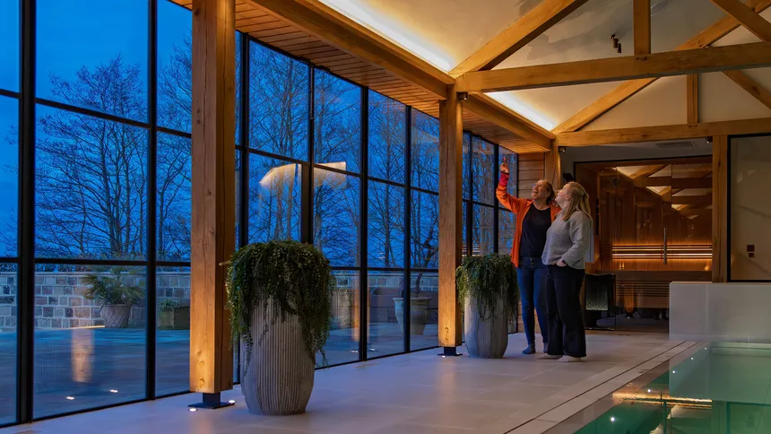 Fran and Hayley looking at the detail of the lighting in a swimming pool