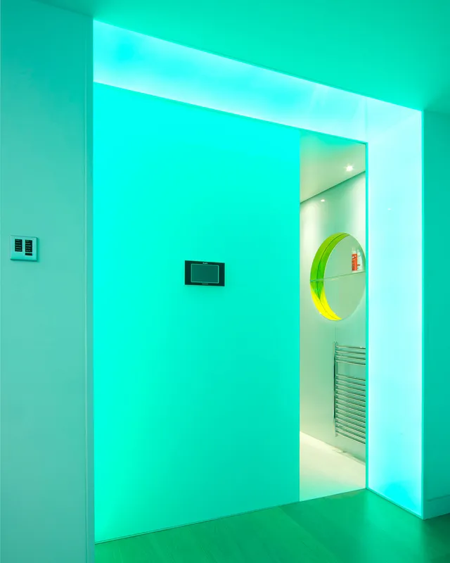 Light-changing LED lightsheet entrance to a sauna - cyan