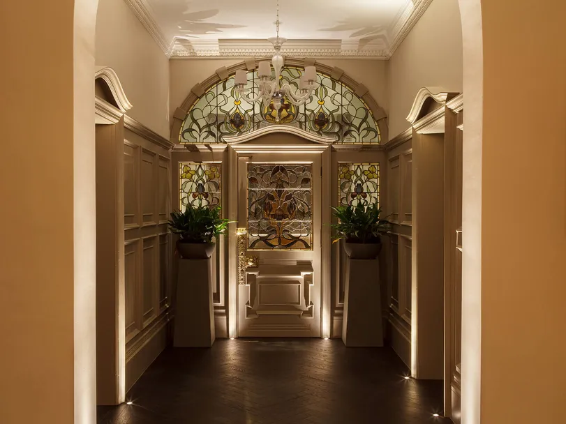 An Edwardian entrance porch and hallway with accent lighting and classic contemporary pendant, pendant off