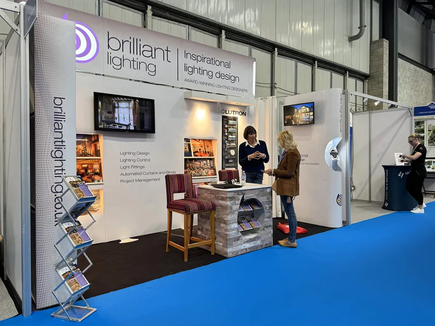 Melanie talking to a visitor to the NEC Homebuilding & Renovating Show in 2024.
