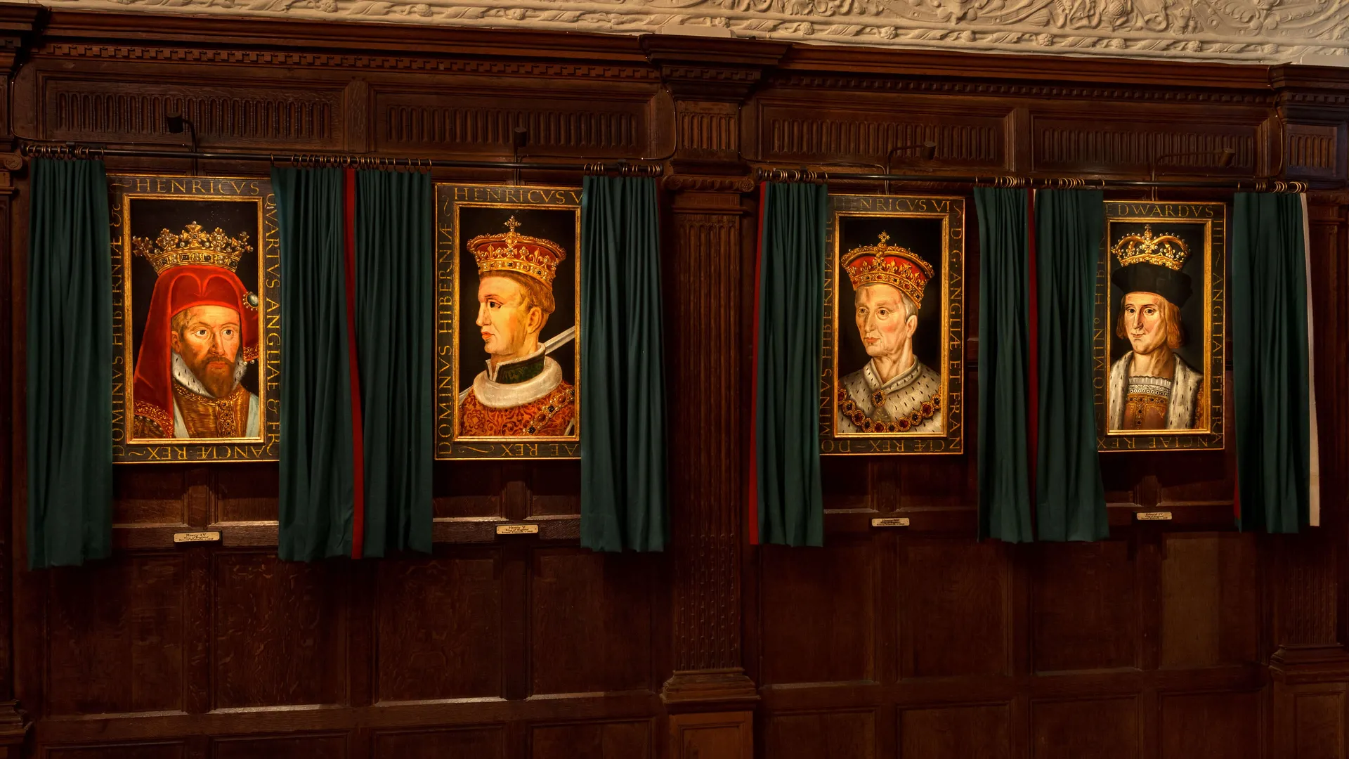 A collection of four portraits of the Tudors lit with specialist narrow beam angle spotlights