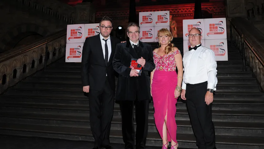 Iain Shaw receiving the 2015 CEDIA award for Best Lighting Scheme from Danny Wallace