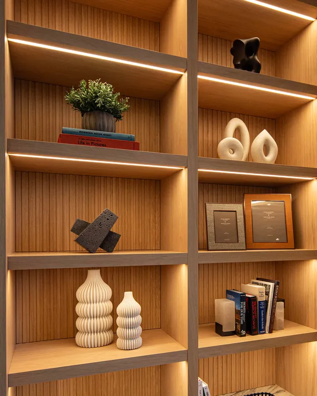 Detail of LED linear lighting in the underside of built-in shelves