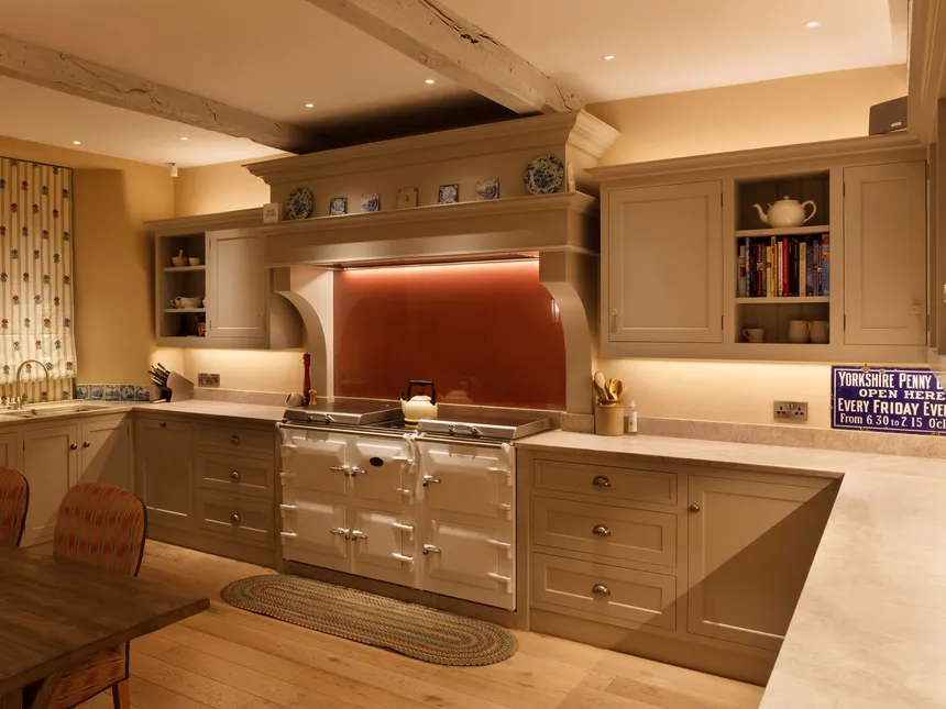 Country house kitchen with linear lighting the aga
